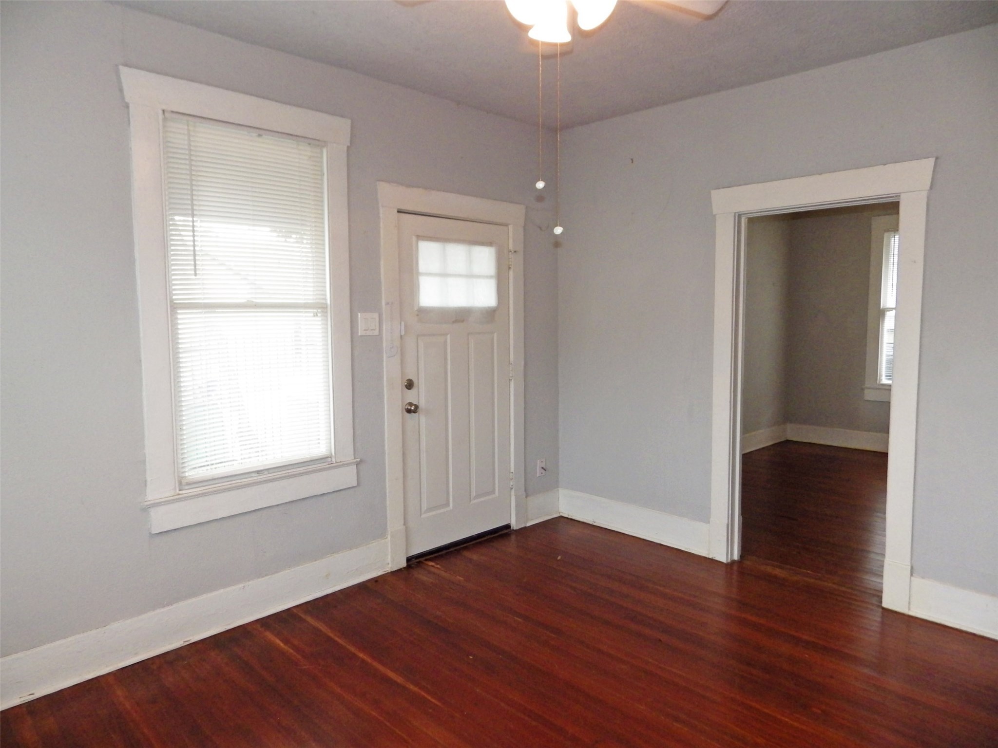 4322 Wilmer Street Houston, TX 77003 - Photo 5 of 31 an empty room with wooden floor closet and windows