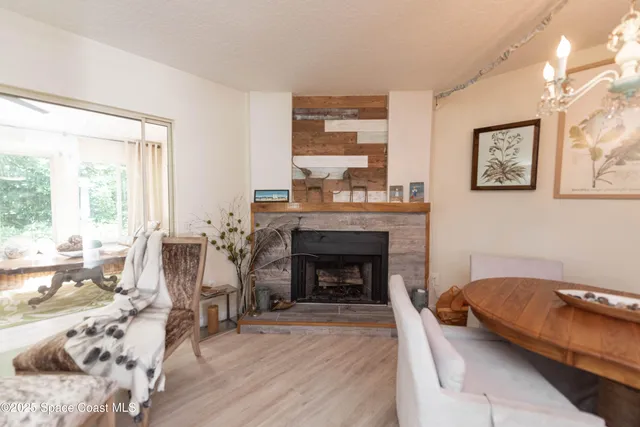 a bedroom with a bed and a fireplace