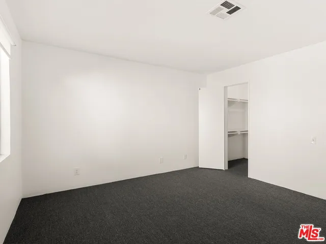 a view of storage and utility room with washer and dryer