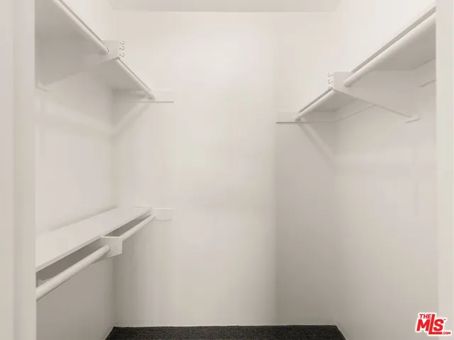 a bathroom with a sink a toilet a shower and a mirror