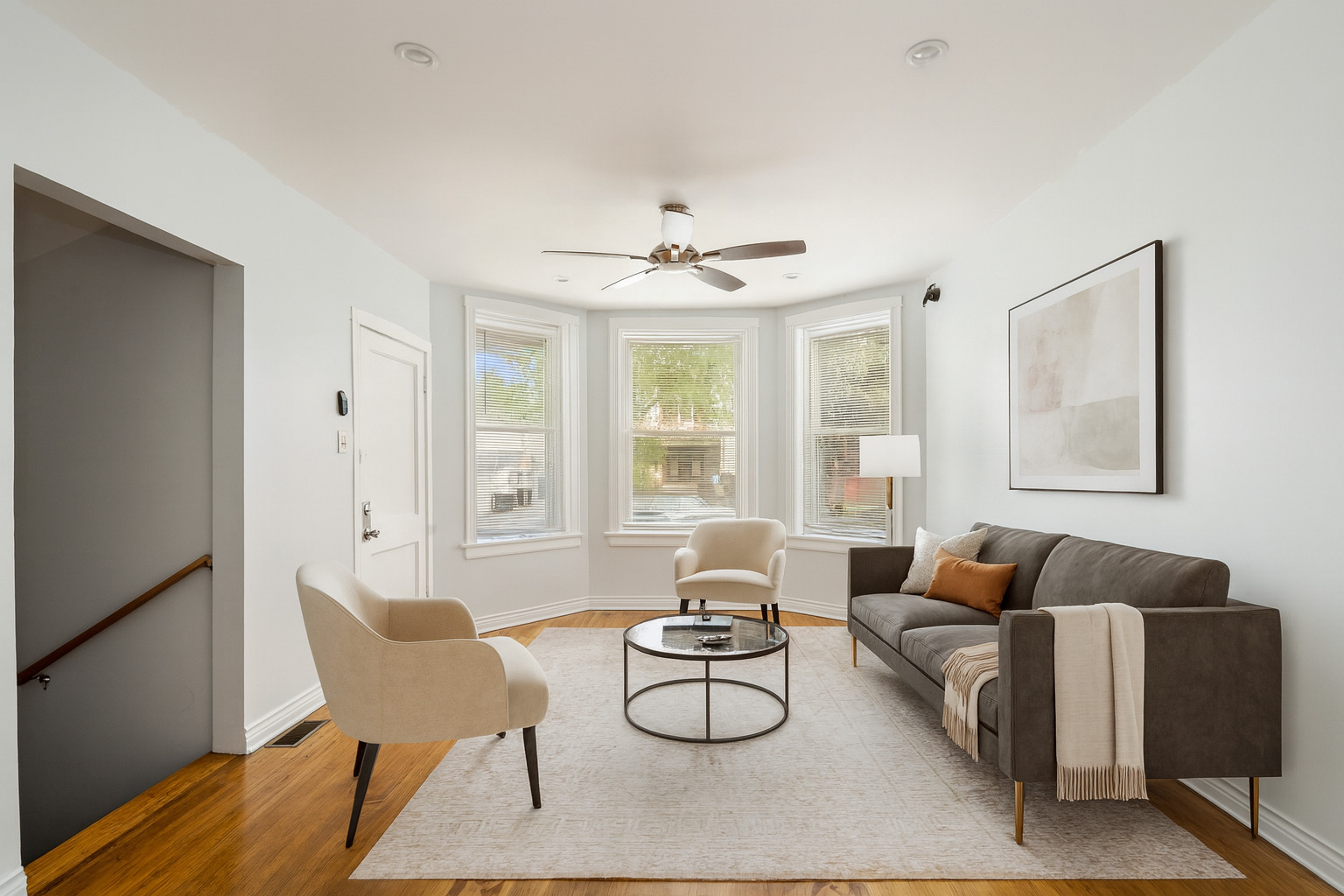 4247 West Melrose Street, Unit 1 Chicago, IL 60641 - Photo 2 of 6 a living room with furniture a table and a large window