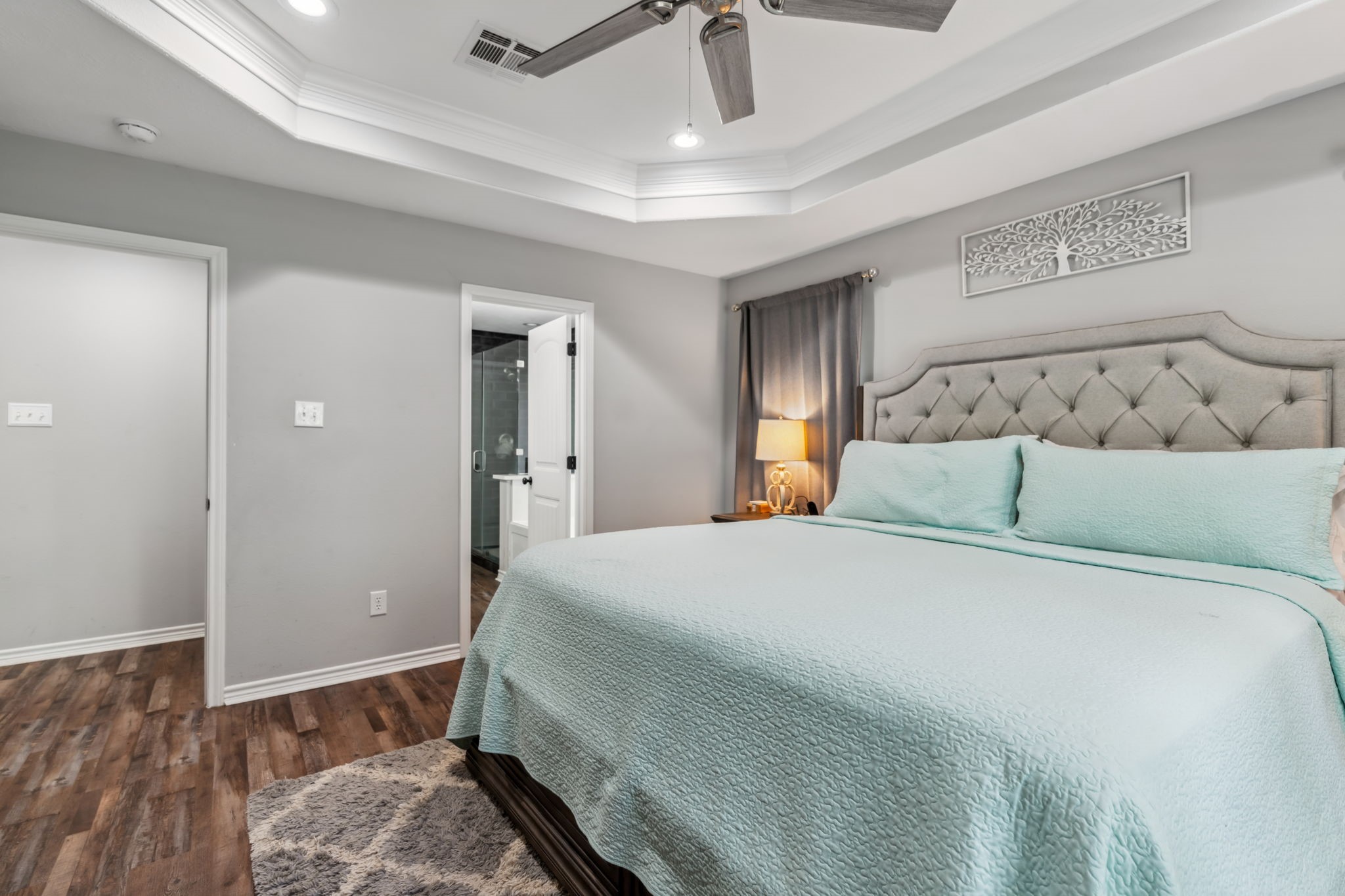 129 Bridgepoint Onalaska, TX 77360 - Photo 14 of 35 a bedroom with a bed and wooden floor