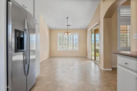 a view of livingroom with an entryway and chandelier