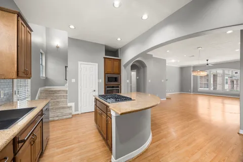 a view of a kitchen with a sink and a window