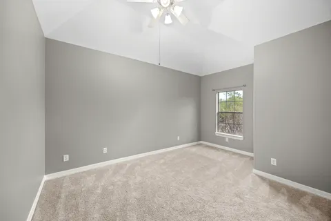 a view of a storage & utility room with a window