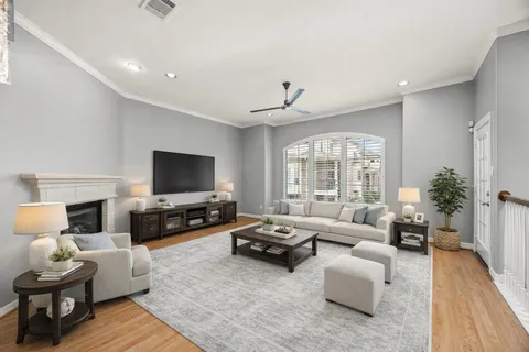 a view of empty room with wooden floor fireplace and windows