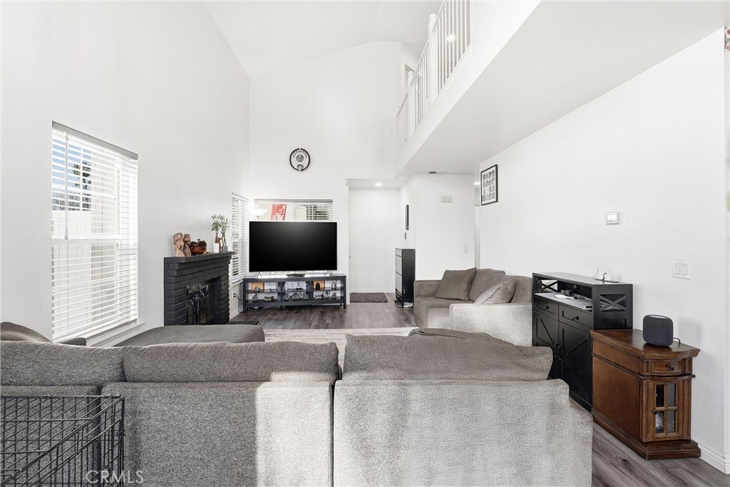 7639 Hillhurst Drive Riverside, CA 92508 - Photo 12 of 60 a living room with furniture and a flat screen tv