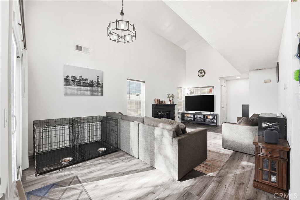 7639 Hillhurst Drive Riverside, CA 92508 - Photo 16 of 60 a living room with furniture and a flat screen tv