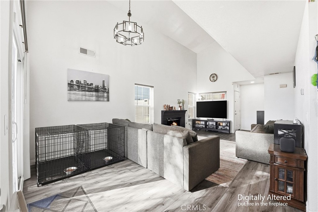 7639 Hillhurst Drive Riverside, CA 92508 - Photo 17 of 60 a living room with furniture and a flat screen tv