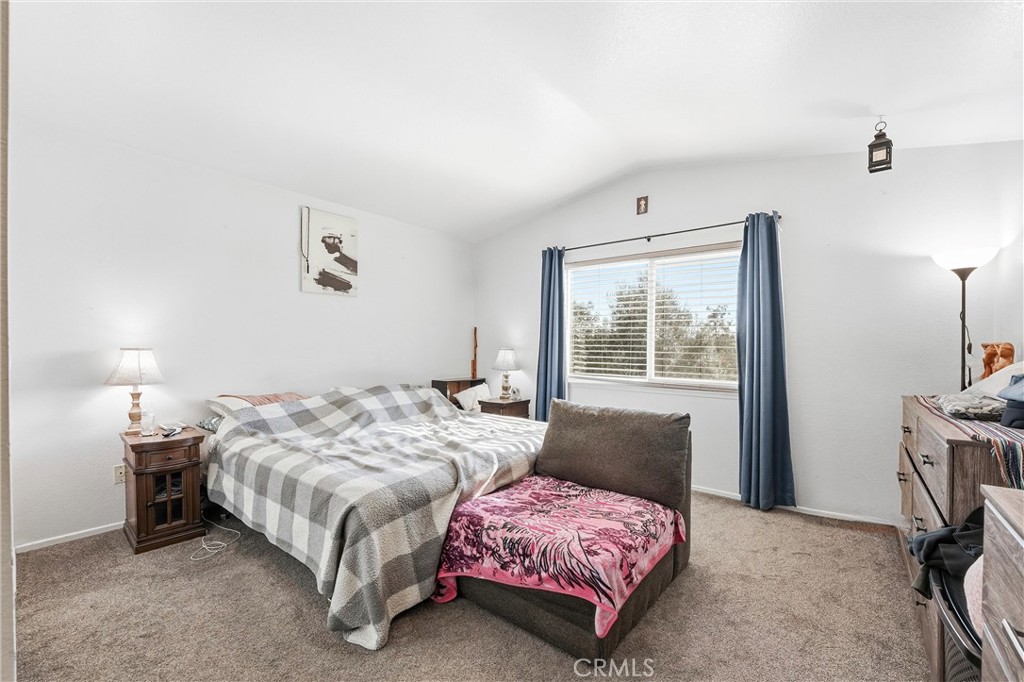 7639 Hillhurst Drive Riverside, CA 92508 - Photo 35 of 60 a bedroom with a bed and a window