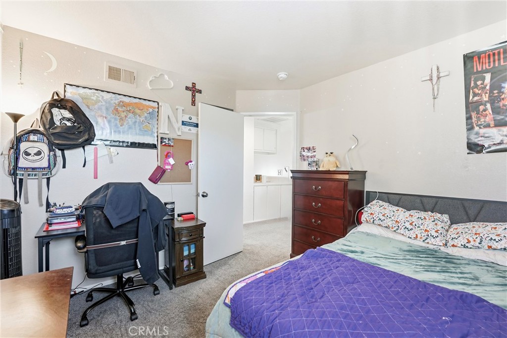 7639 Hillhurst Drive Riverside, CA 92508 - Photo 37 of 60 a bedroom with a bed and a desk