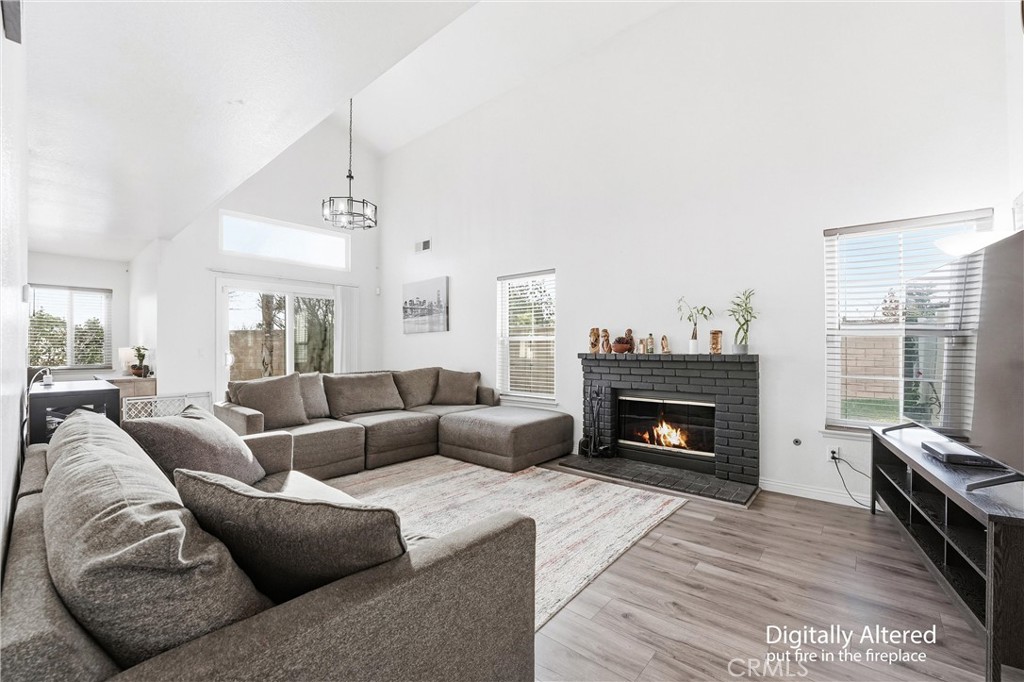 7639 Hillhurst Drive Riverside, CA 92508 - Photo 9 of 60 a living room with furniture and a fireplace