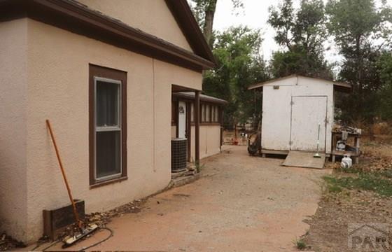 11229 County Rd JJ 5 Manzanola, CO 81058 - Photo 5 of 32 a view of a house with backyard and garage