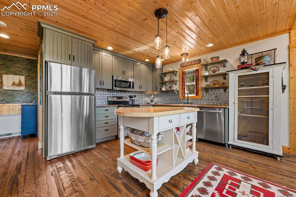 163 Wonder Trail Rye, CO 81069 - Photo 19 of 50 a kitchen with kitchen island a sink appliances and cabinets