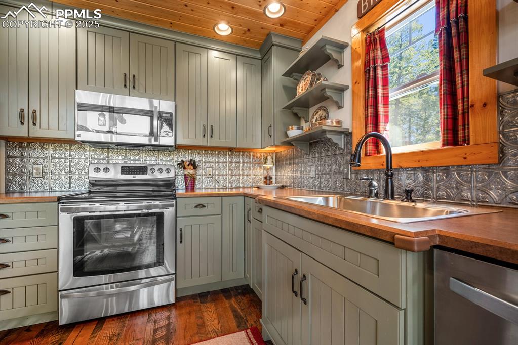 163 Wonder Trail Rye, CO 81069 - Photo 20 of 50 a kitchen with a sink stove and cabinets
