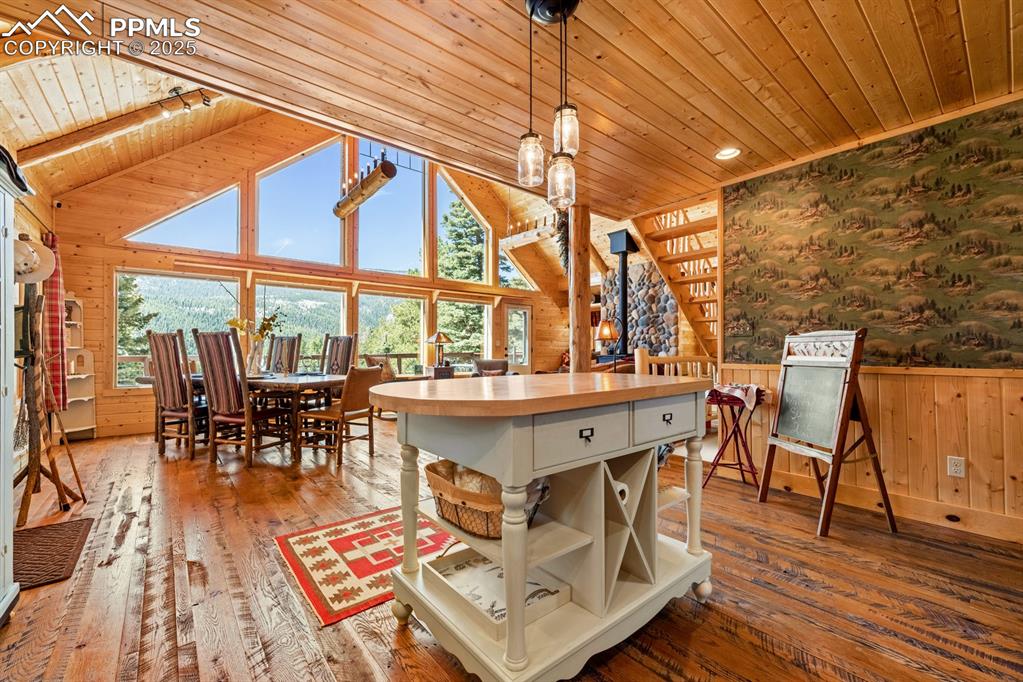163 Wonder Trail Rye, CO 81069 - Photo 22 of 50 a dining room with furniture a rug and a floor to ceiling window