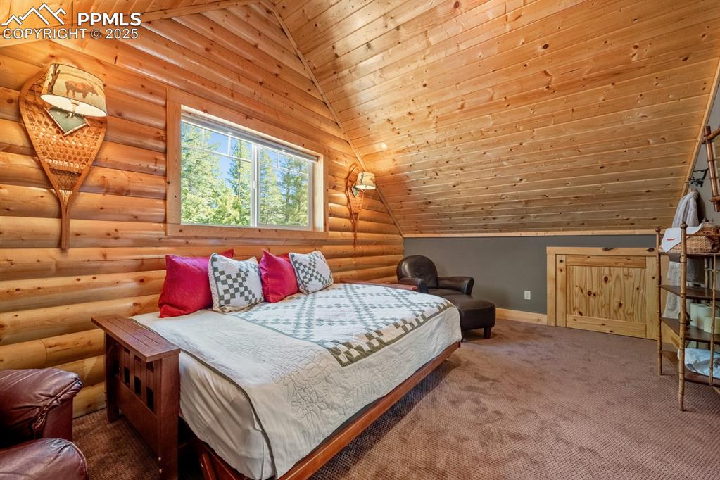 163 Wonder Trail Rye, CO 81069 - Photo 26 of 50 a bedroom with a bed and wooden floor