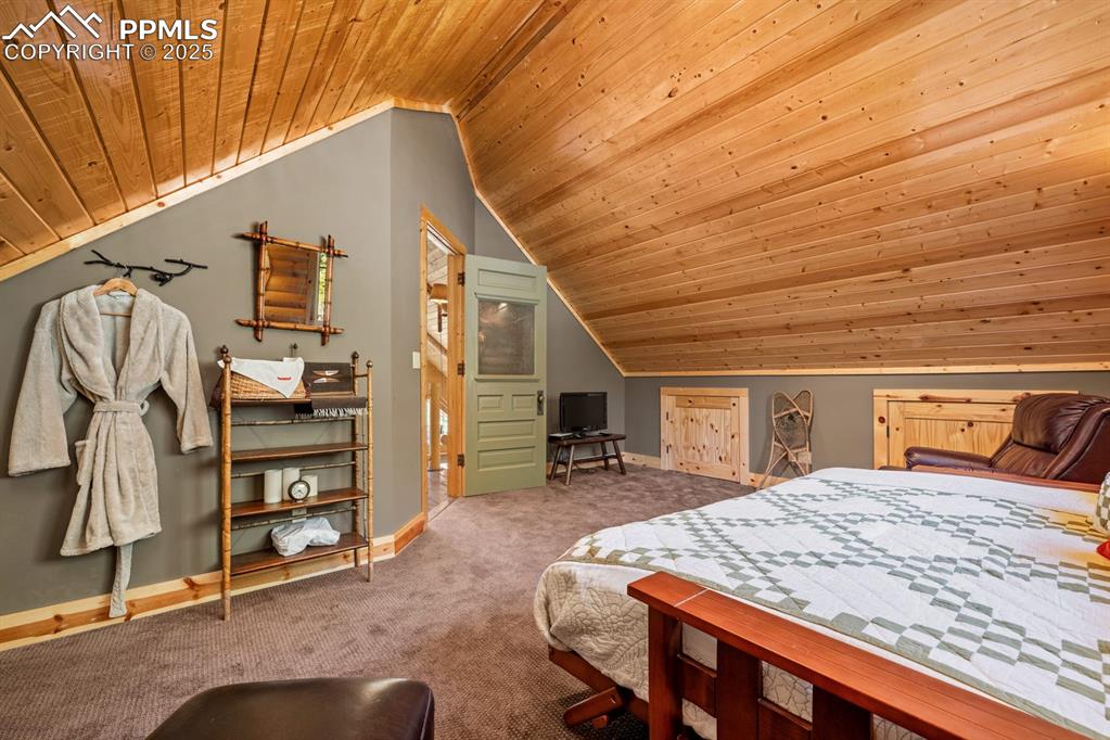 163 Wonder Trail Rye, CO 81069 - Photo 27 of 50 a bedroom with a bed next to a window