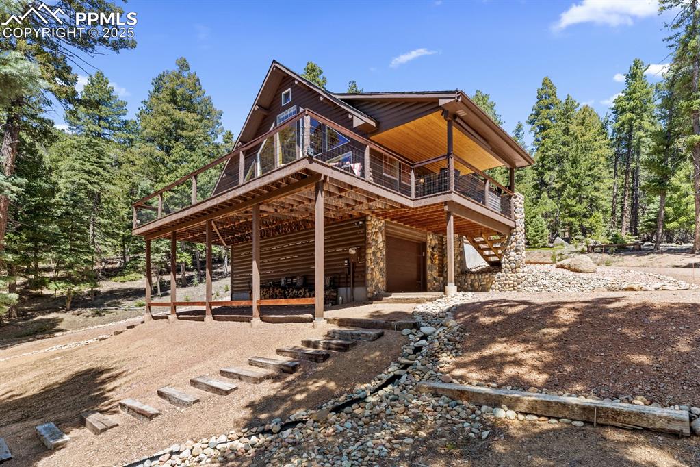 163 Wonder Trail Rye, CO 81069 - Photo 5 of 50 a front view of a house with a yard