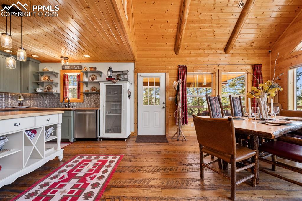 163 Wonder Trail Rye, CO 81069 - Photo 9 of 50 a dining room with stainless steel appliances kitchen island granite countertop furniture and a rug