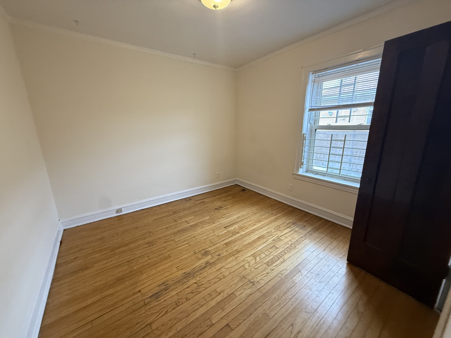 3152 North Linder Avenue, Unit 1 Chicago, IL 60641 - Photo 5 of 12 wooden floor in an empty room