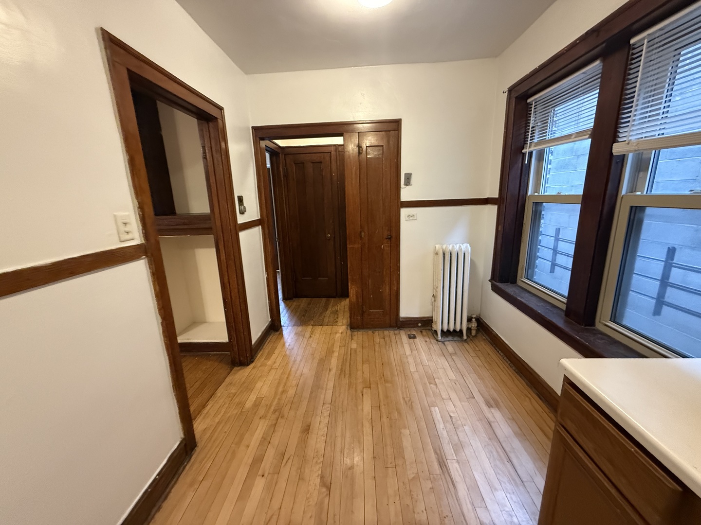 3152 North Linder Avenue, Unit 1 Chicago, IL 60641 - Photo 8 of 12 a view of front door with wooden floor and a window