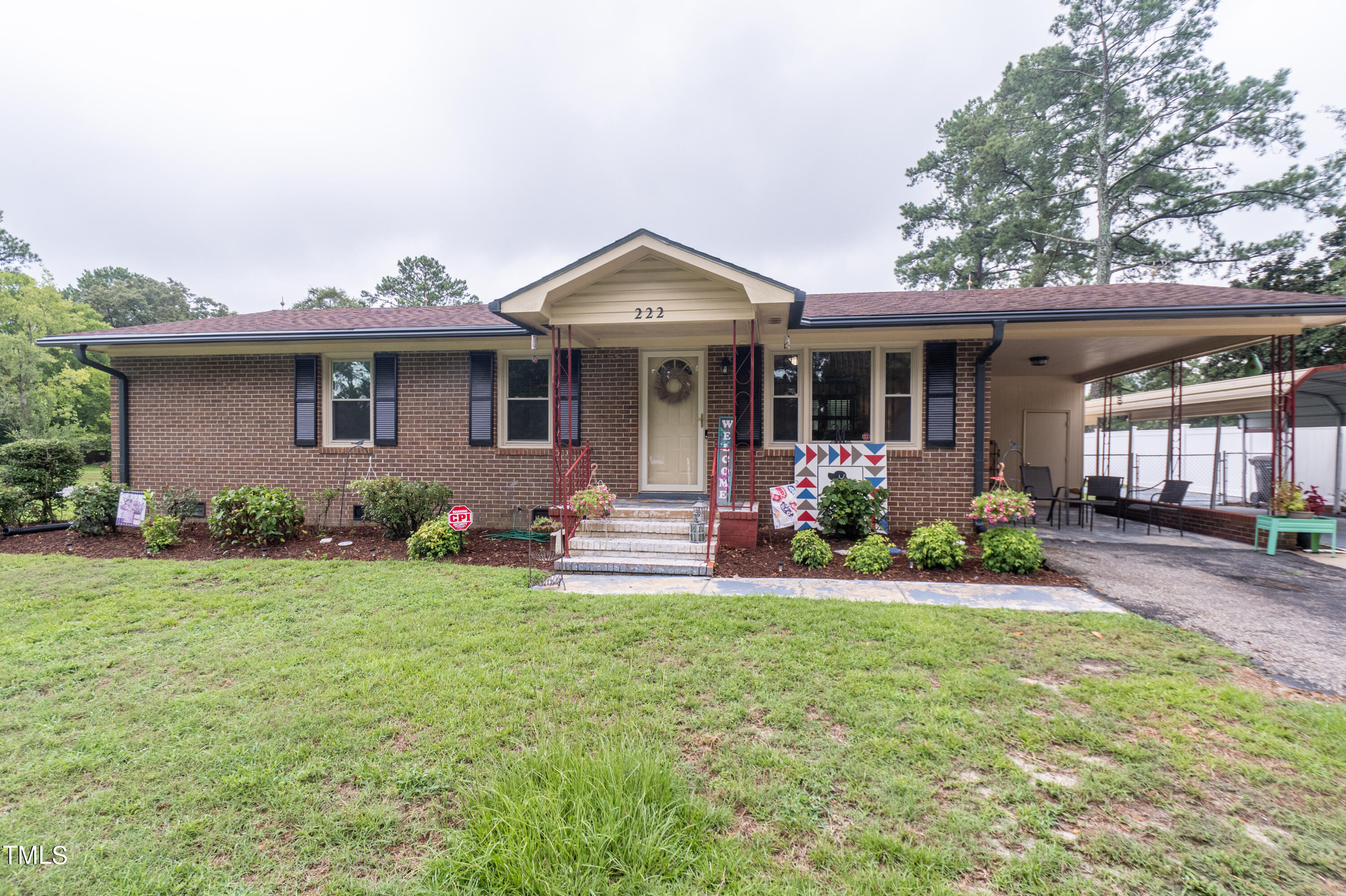 a view of a house with backyard porch and sitting area