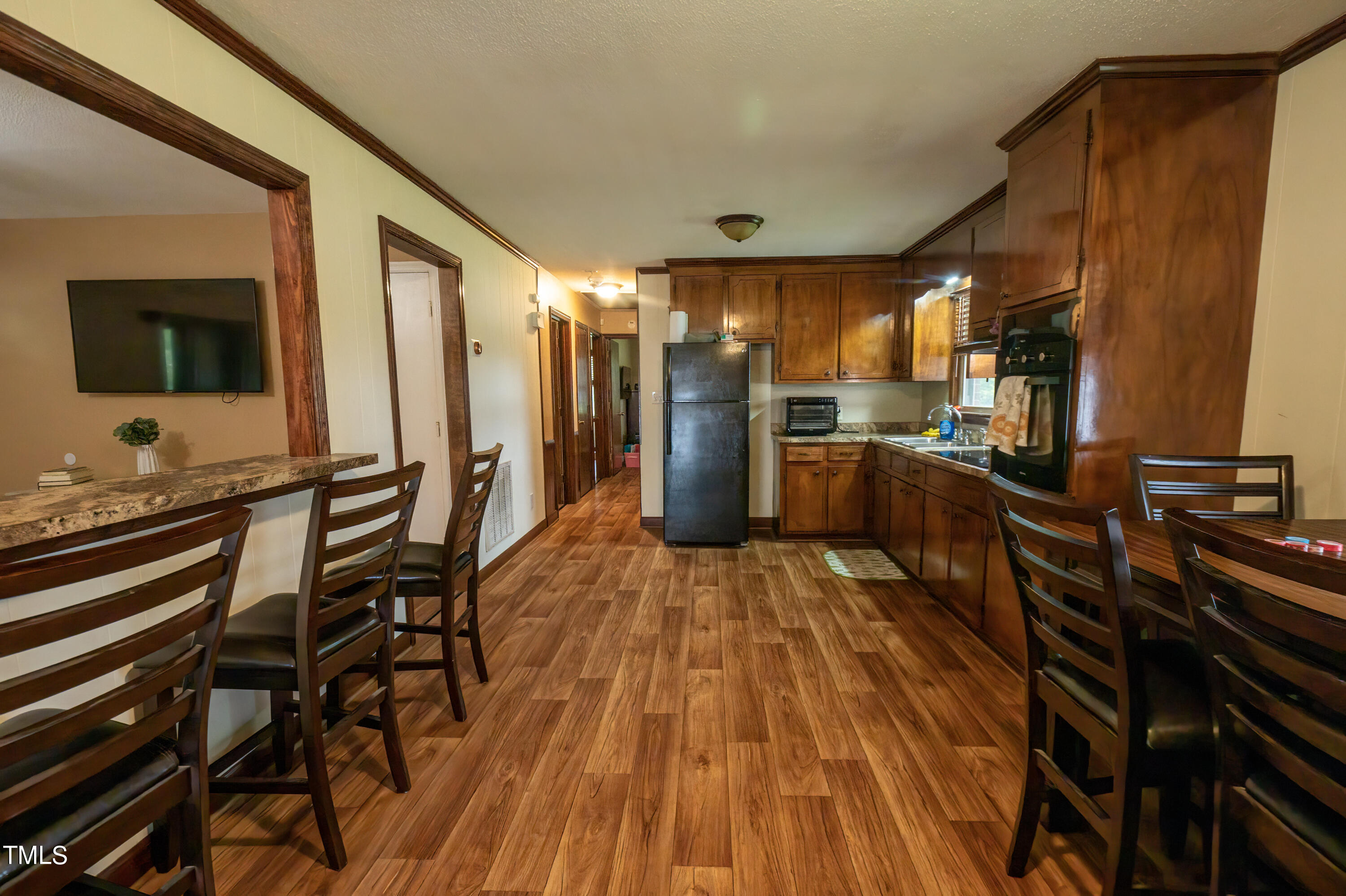 222 Rollingwood Drive Dudley, NC 28333 - Photo 6 of 14 a open kitchen with a table and chairs in it