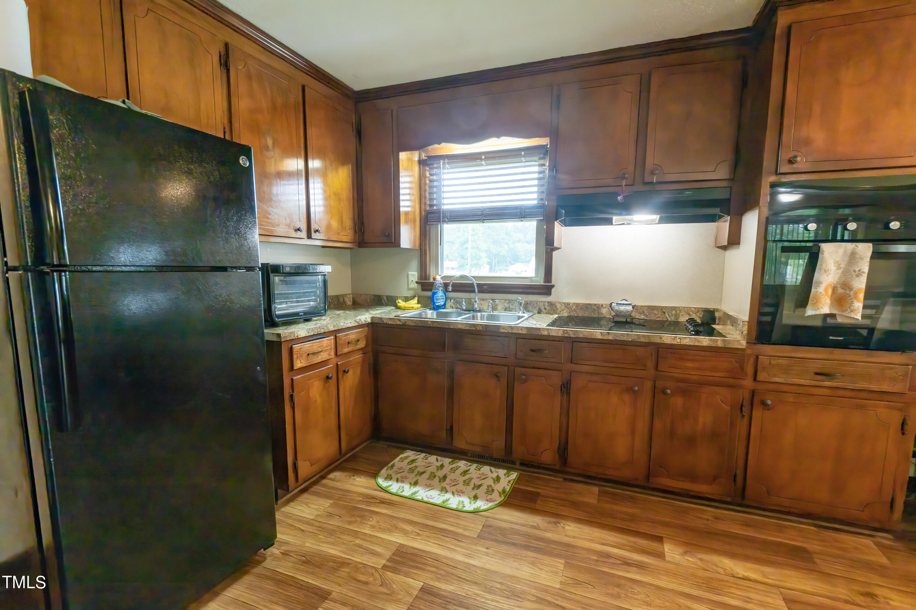222 Rollingwood Drive Dudley, NC 28333 - Photo 7 of 14 a kitchen with stainless steel appliances granite countertop a refrigerator a sink and a stove