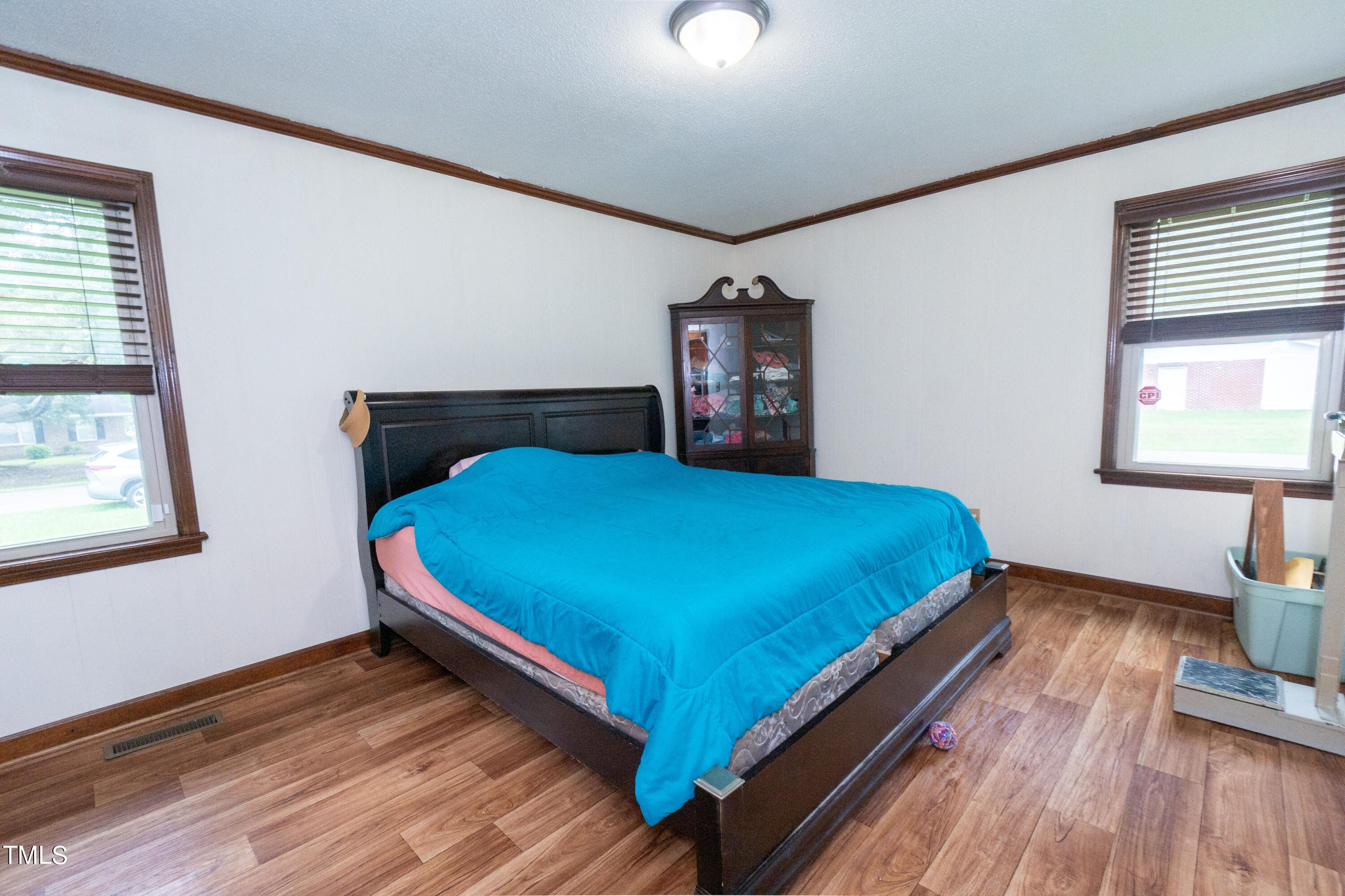 222 Rollingwood Drive Dudley, NC 28333 - Photo 8 of 14 a bedroom with a bed and wooden floor