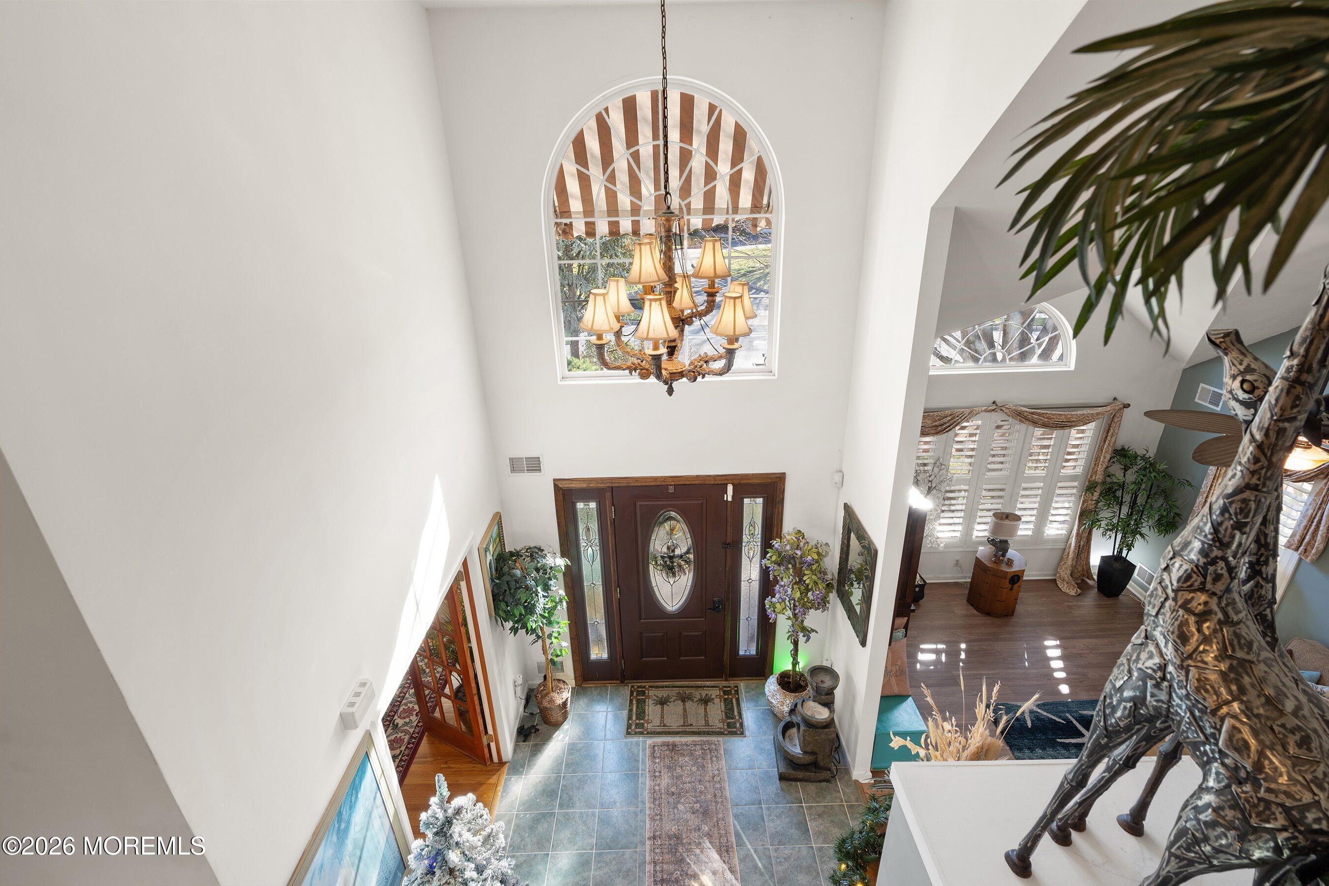 648 Point Avenue Brick, NJ 08724 - Photo 19 of 40 an entryway with a fireplace and wooden floor