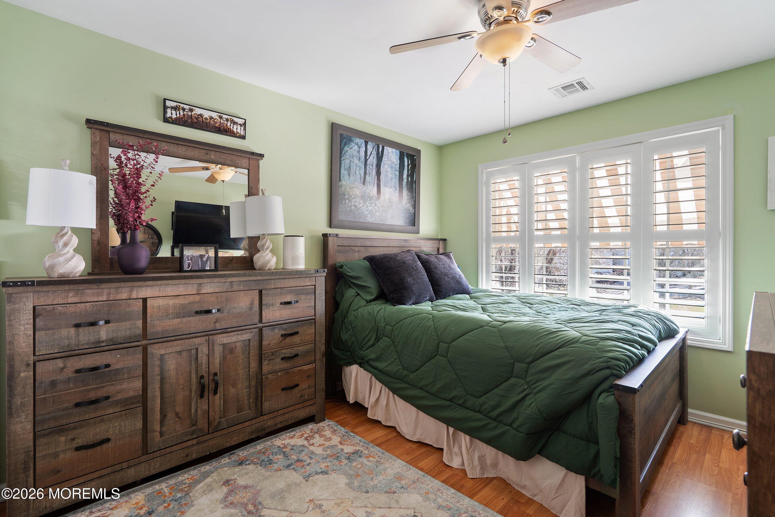 648 Point Avenue Brick, NJ 08724 - Photo 24 of 40 a bedroom with a bed and a mirror on the dresser
