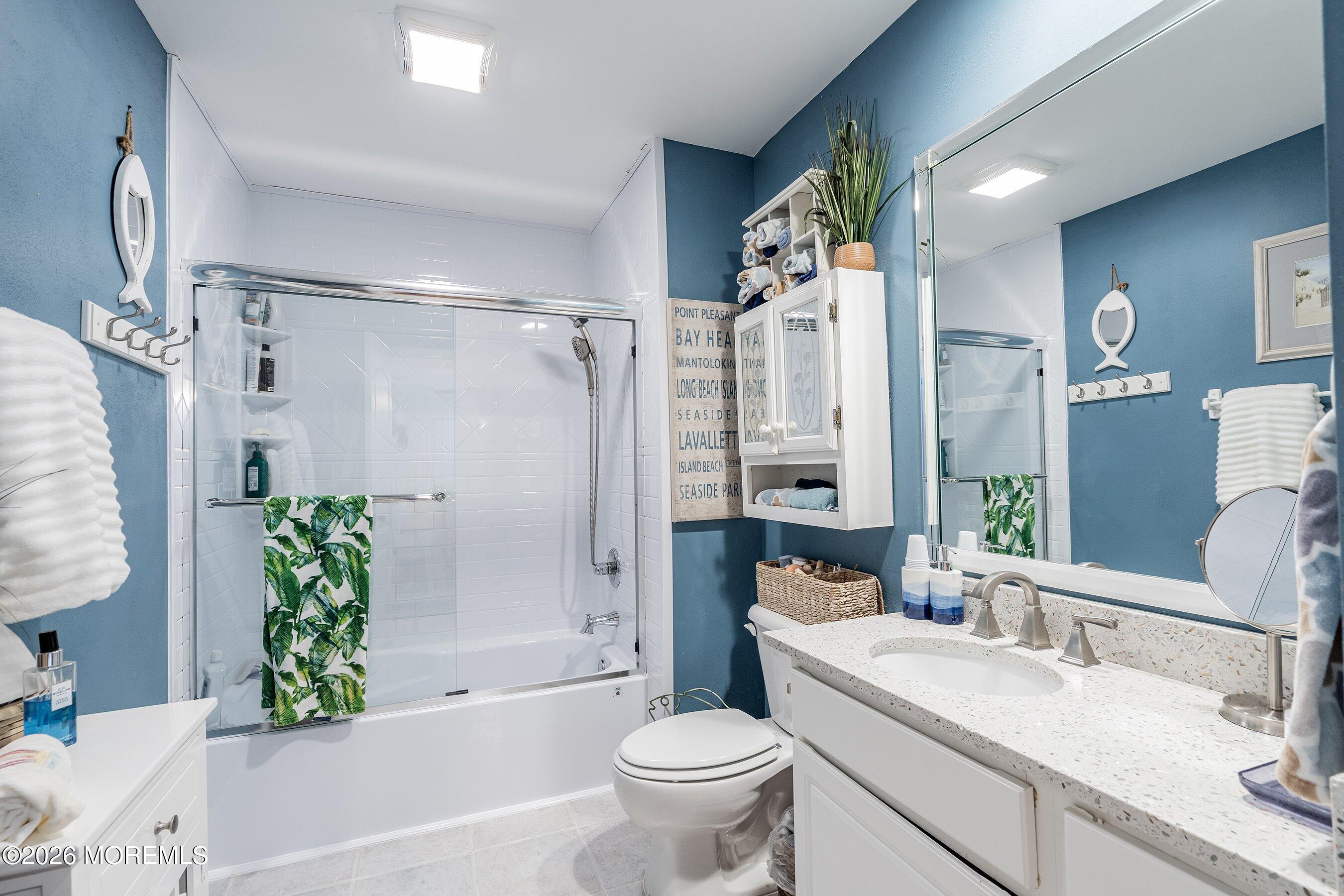 648 Point Avenue Brick, NJ 08724 - Photo 27 of 40 a bathroom with a granite countertop sink a toilet and shower