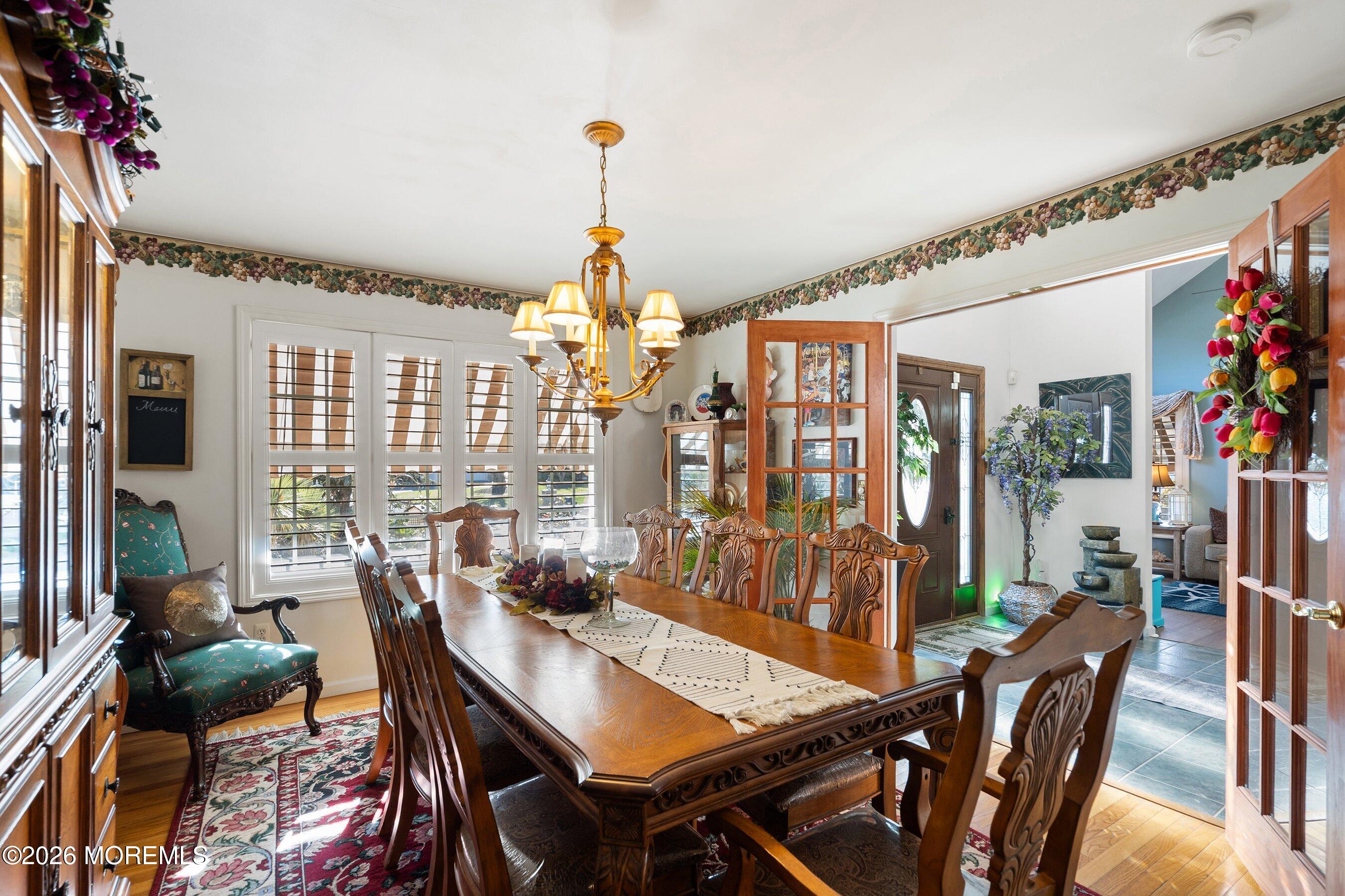648 Point Avenue Brick, NJ 08724 - Photo 8 of 40 a view of a dining room with furniture window and wooden floor
