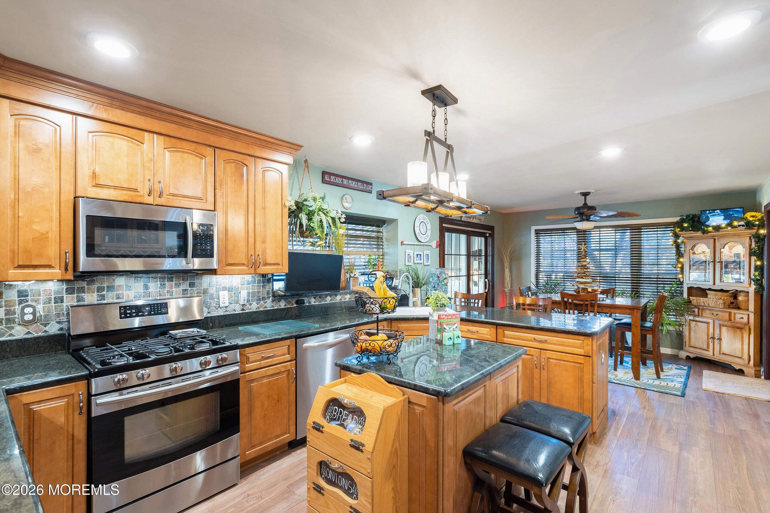 648 Point Avenue Brick, NJ 08724 - Photo 9 of 40 a kitchen with lots of counter top space and stainless steel appliances