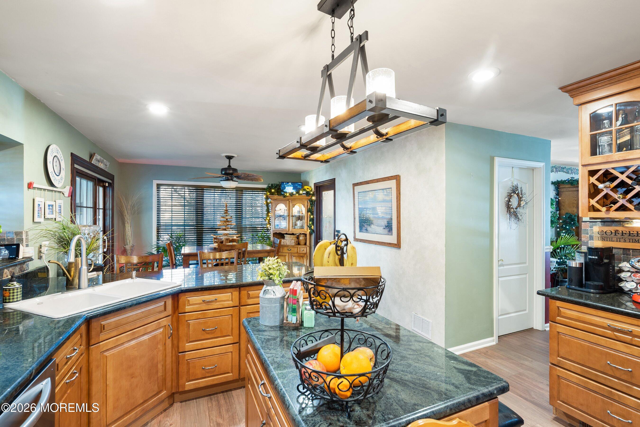 648 Point Avenue Brick, NJ 08724 - Photo 10 of 40 a living room with fireplace furniture and a chandelier
