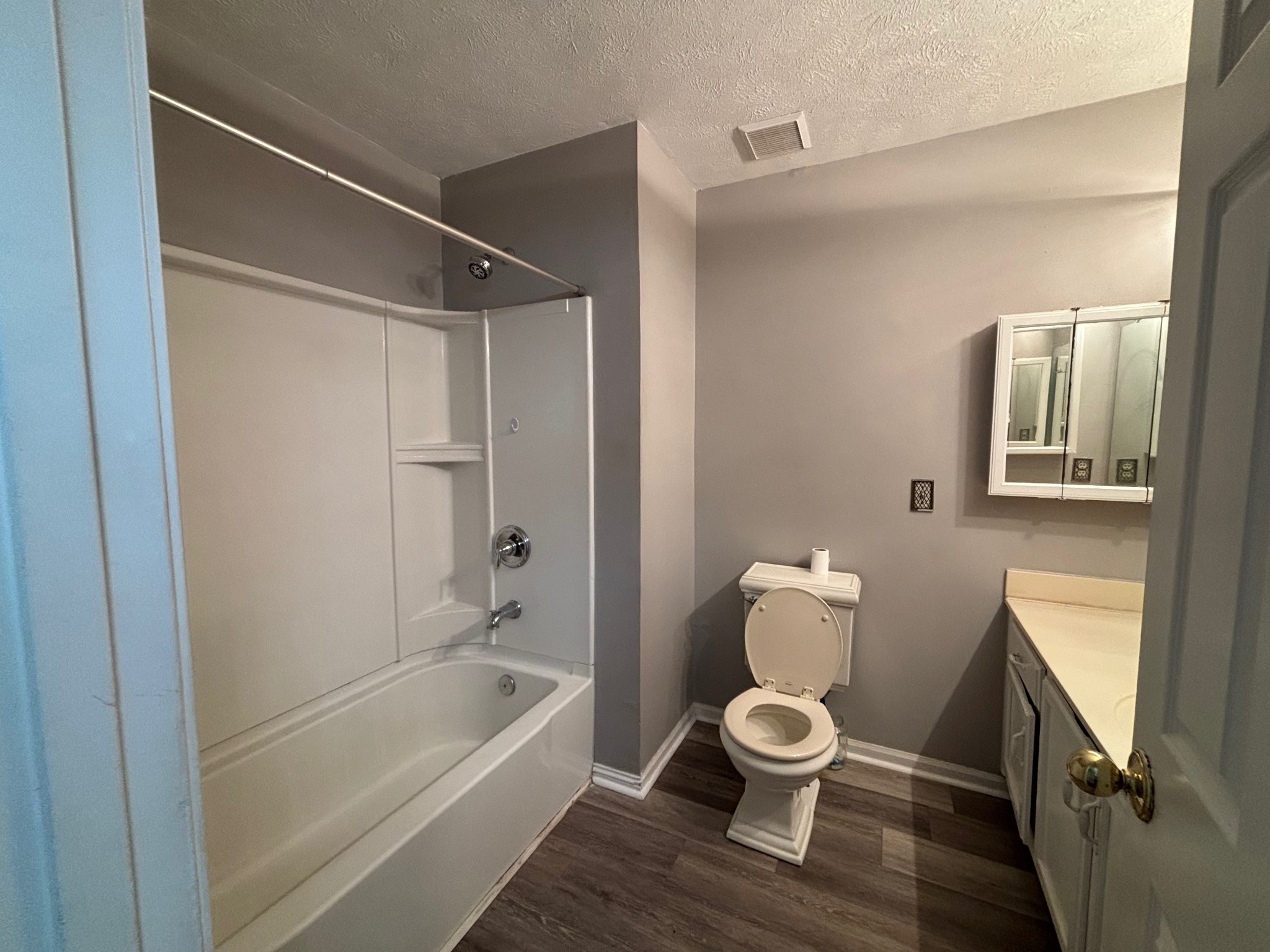 917 Tavistock Place Antioch, TN 37013 - Photo 5 of 14 a bathroom with a toilet a sink and bathtub