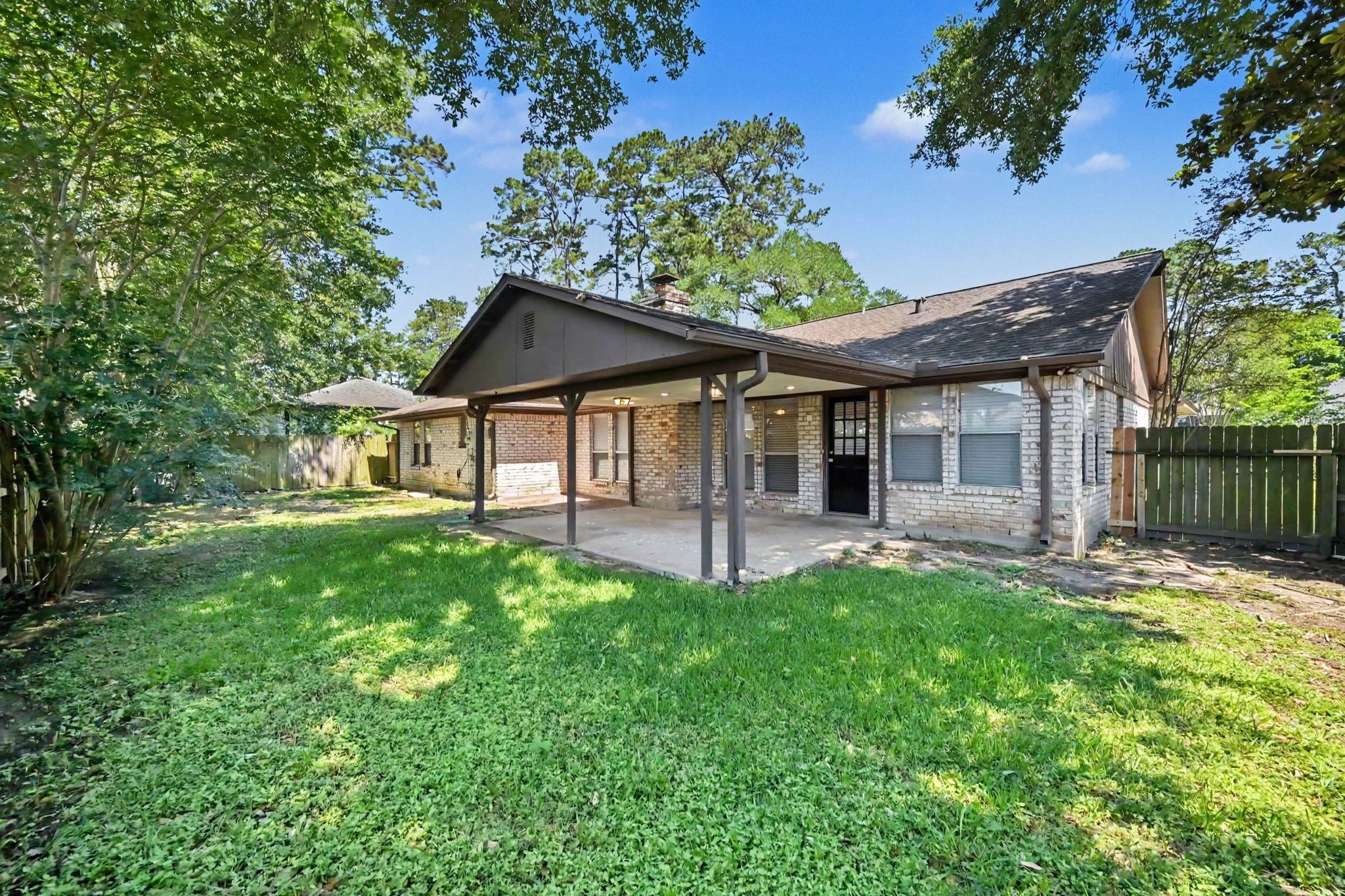 17419 Cassina Drive Spring, TX 77388 - Photo 34 of 35 a front view of a house with a garden and porch