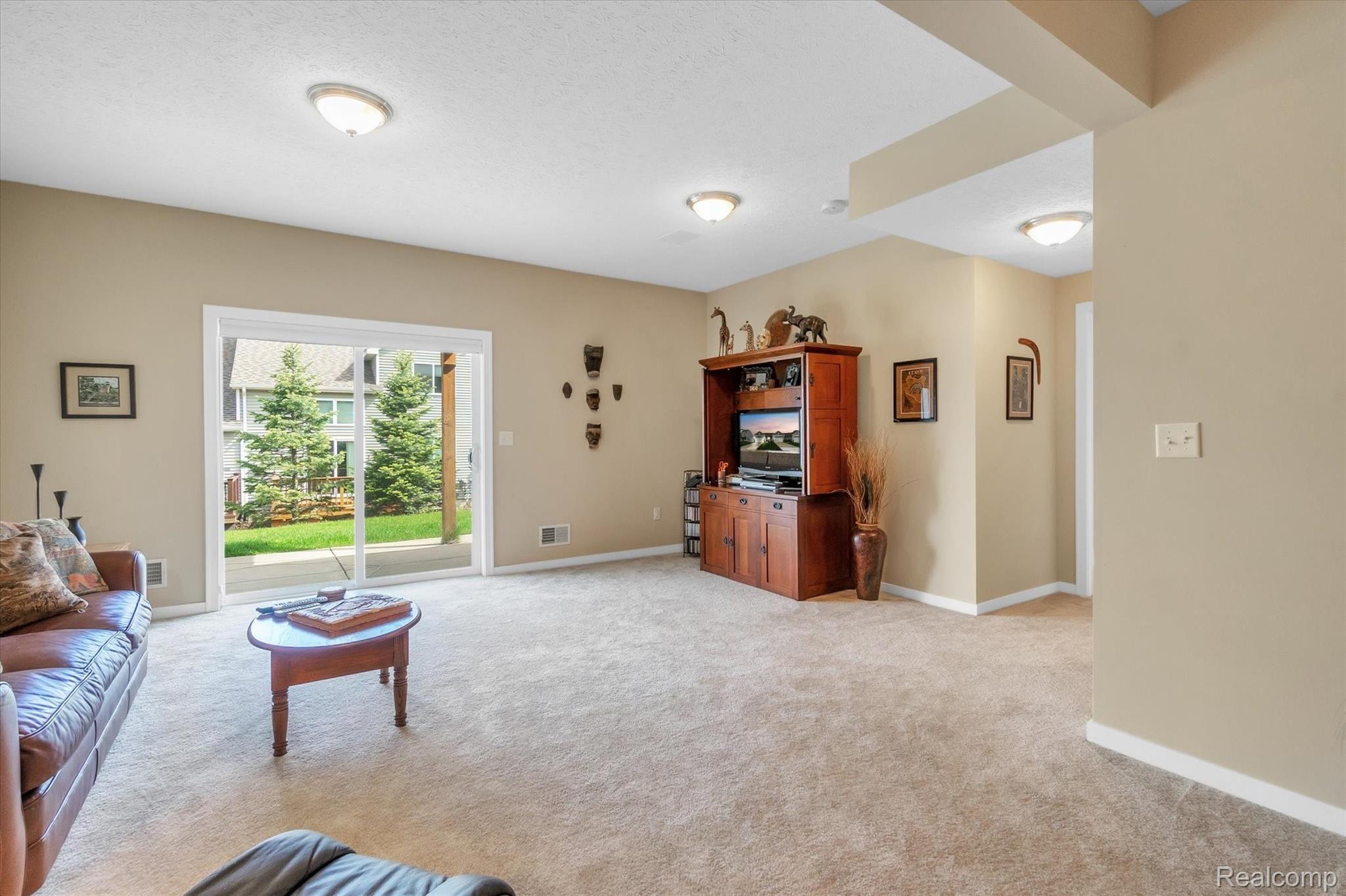 905 Spirea Howell, MI 48843 - Photo 24 of 35 Walkout with patio makes a nice extension to the family room area