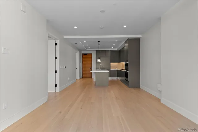 a view of a kitchen with a sink and cabinets