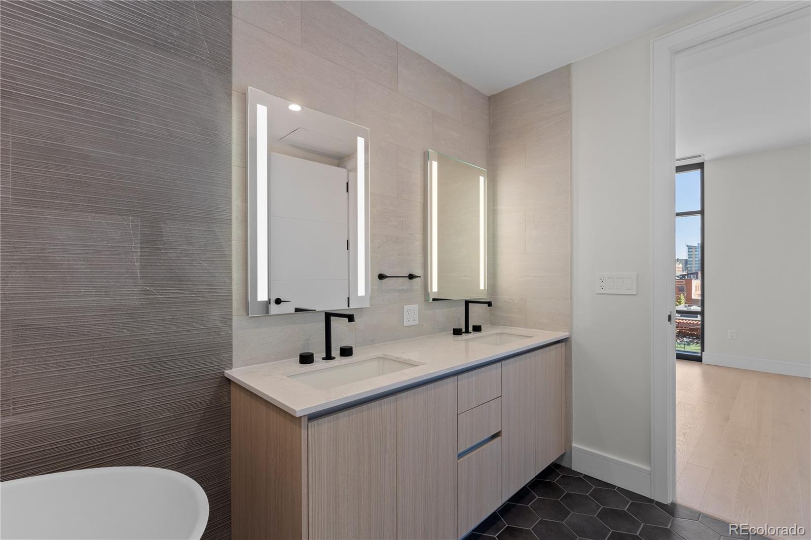 1901 Wazee Street, Unit 507 Denver, CO 80202 - Photo 20 of 45 a bathroom with a toilet sink and mirror