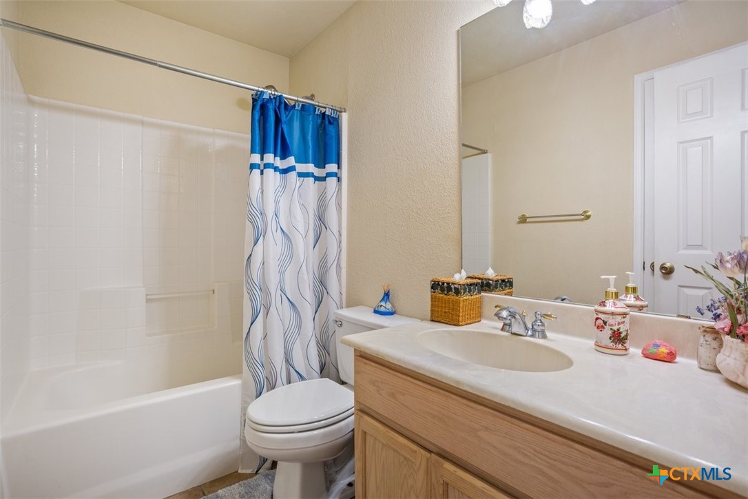 8 Sycamore Court Belton, TX 76513 - Photo 23 of 30 a bathroom with a sink toilet and shower