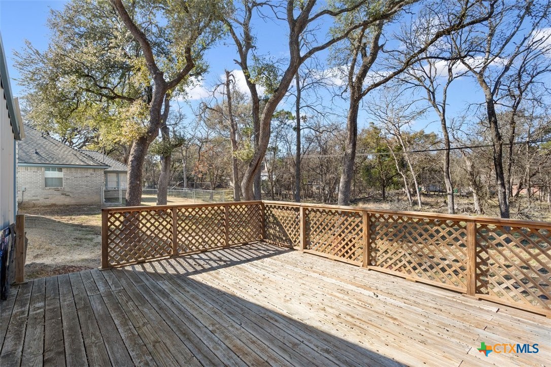 8 Sycamore Court Belton, TX 76513 - Photo 30 of 30 a view of a roof deck with wooden floor and fence