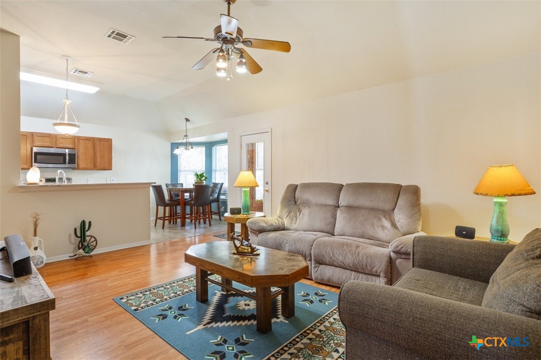 8 Sycamore Court Belton, TX 76513 - Photo 9 of 30 a living room with furniture a rug and a lamp