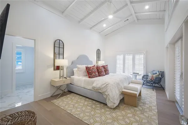 a bedroom with bed and window
