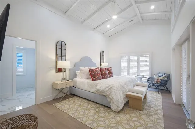 a bedroom with bed and window