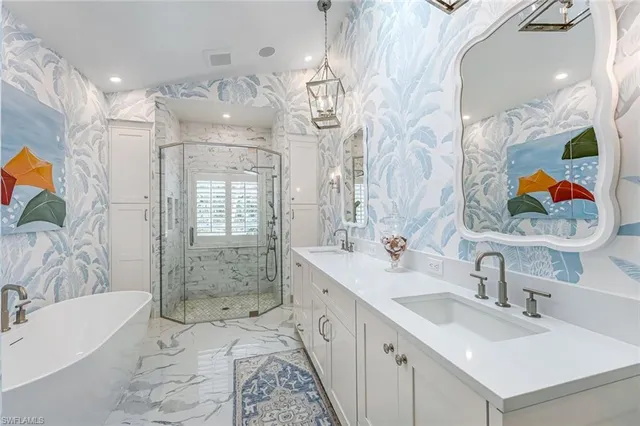 a bathroom with a double vanity sink mirror and shower