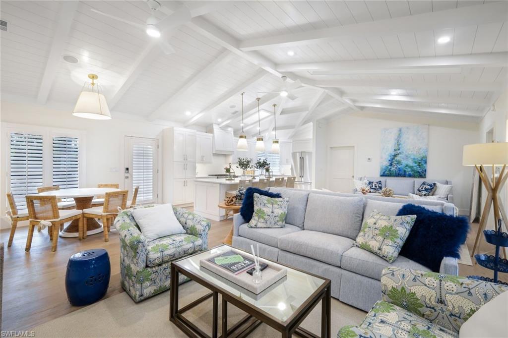 67 8th Avenue South Naples, FL 34102 - Photo 20 of 38 a living room with furniture and a large window