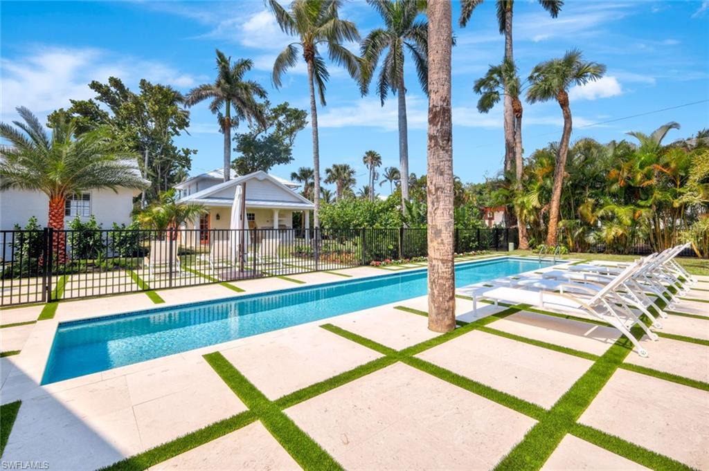 67 8th Avenue South Naples, FL 34102 - Photo 31 of 38 a view of a backyard with palm trees