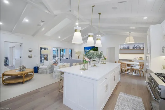 a view of center island kitchen island furniture and living room view